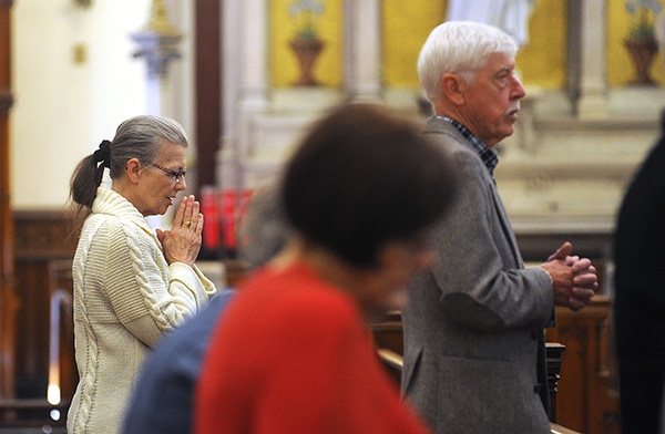 Parishioners pray as Bishop Richard Malone thanks local and national respect life volunteers and coordinators Sept. 9 at St. Louis Church, Buffalo, during the Respect Life Coordinator's In-Service Mass. (Dan Cappellazzo/Staff Photographer)